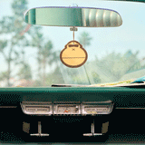 car air freshener hanging from rear view mirror of a car