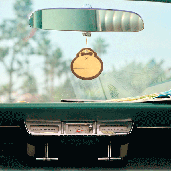 car air freshener hanging from rear view mirror of a car
