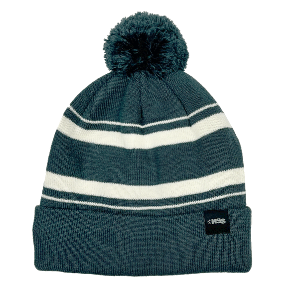 green and white striped pom beanie on white background