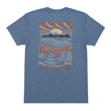 back of heather blue t-shirt with graphic of a pier with sunset in the background. shirt is on a white background
