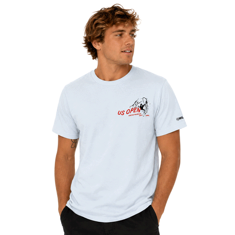 person wearing light blue t-shirt with red & black us open logo on chest