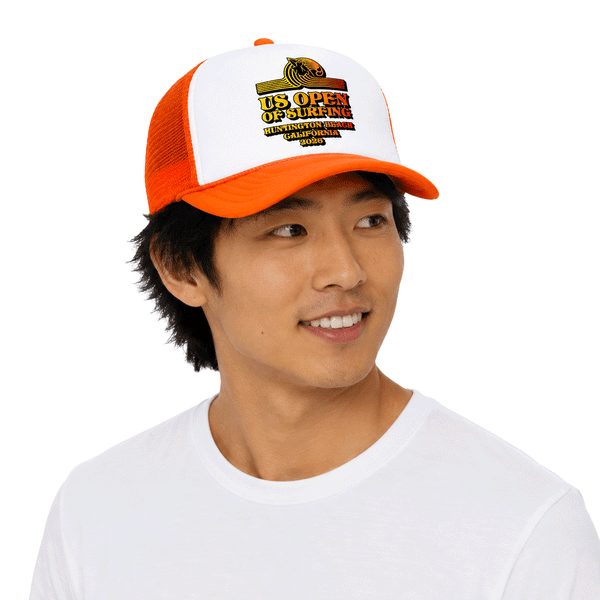 person wearing orange and white trucker hat with US Open's Surfer TM logo in yellow
