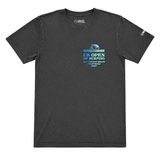 front view of a washed black-colored US Open of Surfing short-sleeve t-shirt displayed on a white background. The tee features a small multicolor retro-style surf graphic on the chest with "US Open of Surfing Huntington Beach California 2026" text and a WSL logo printed on the right sleeve.