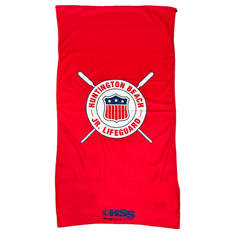 Red beach towel with Huntington Beach Jr. Lifeguard logo on a white background