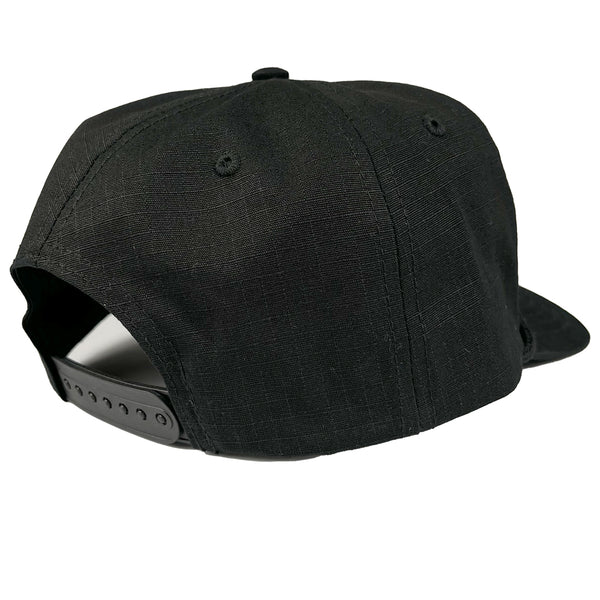Black cap with a textured pattern on a white background