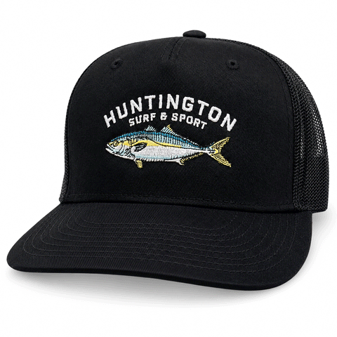 Black cap with 'Huntington Surf & Sport' and fish design on a white background