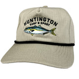 Beige cap with fish design and 'Huntington Surf & Sport' text on a white background