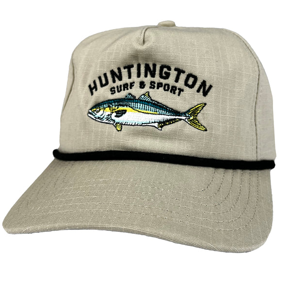 Beige cap with fish design and 'Huntington Surf & Sport' text on a white background